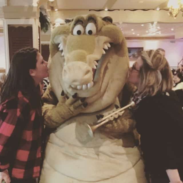 Malloy and Ally kissing an alligator on the Disney Wonder.