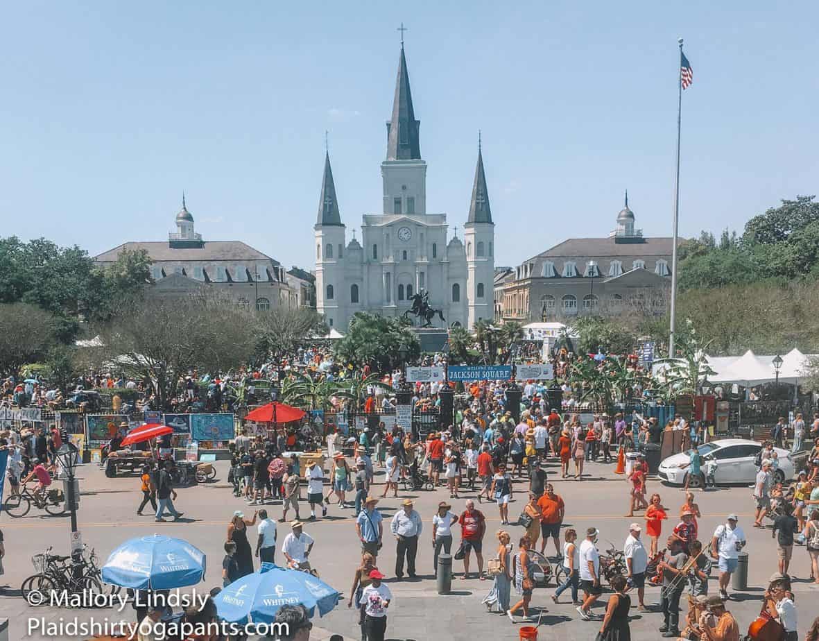 Shot of St Louis Cathedral with a crowd going to see French Quarter Fest