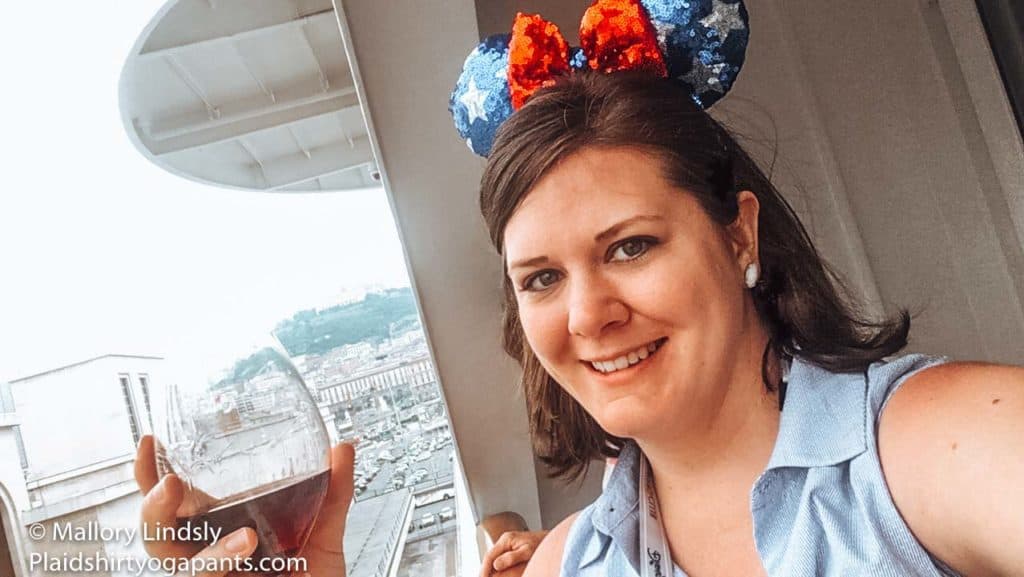 Mallory with Minnie Ears drinking Wine on the Disney Magic