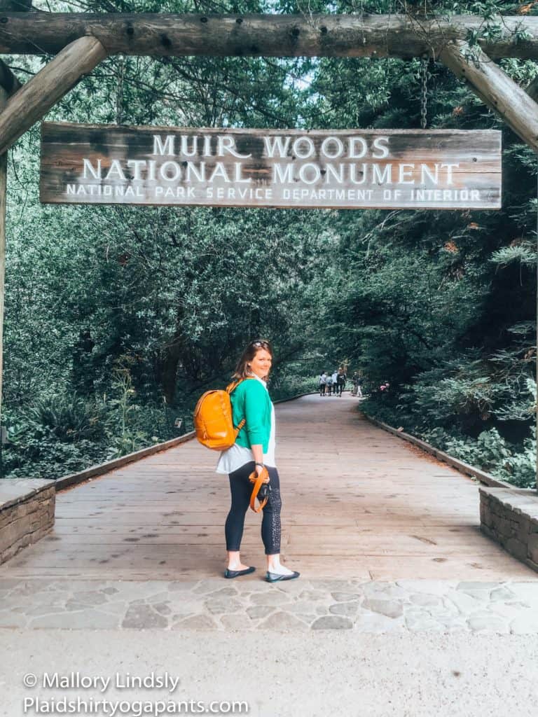 Mallory infront of the Muir Woods Sign