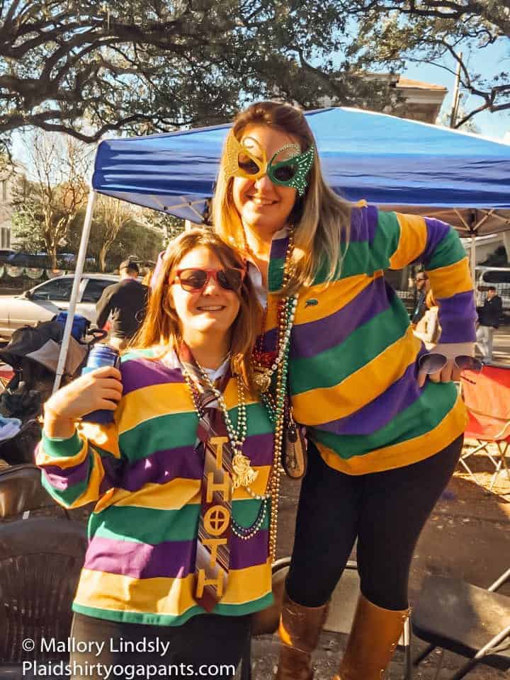 Mallory and Sis wearing purple green and gold. 
