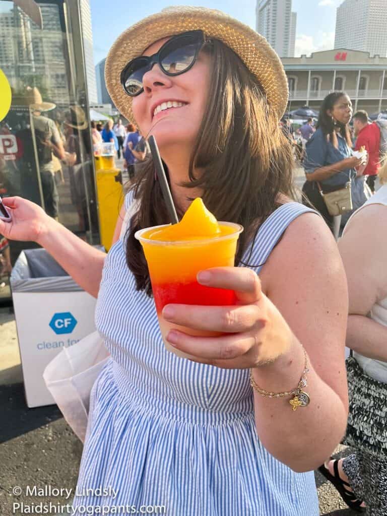Lady wearing seersucker and holding a drink
